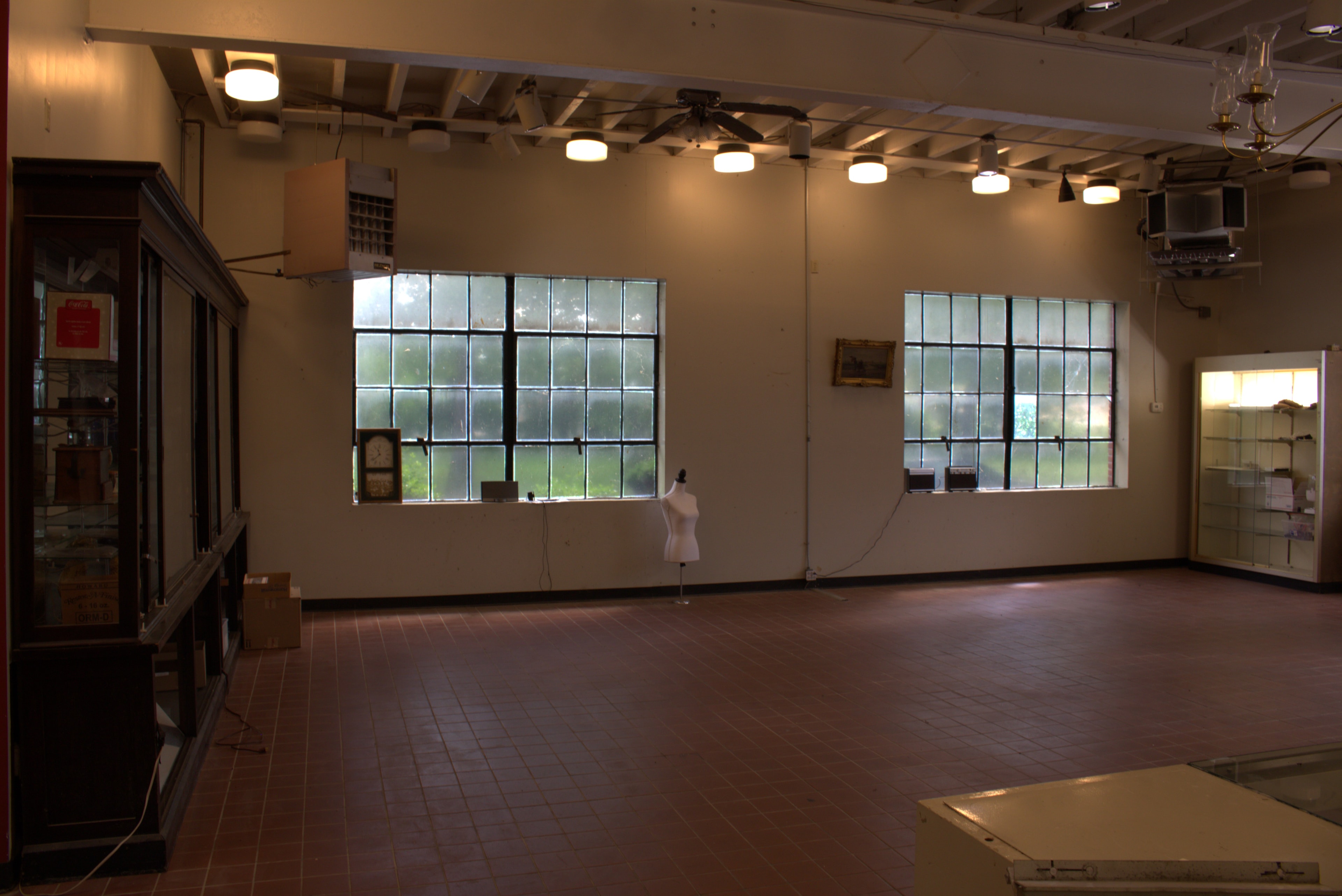 Open main floor with industrial windows and high ceilings
