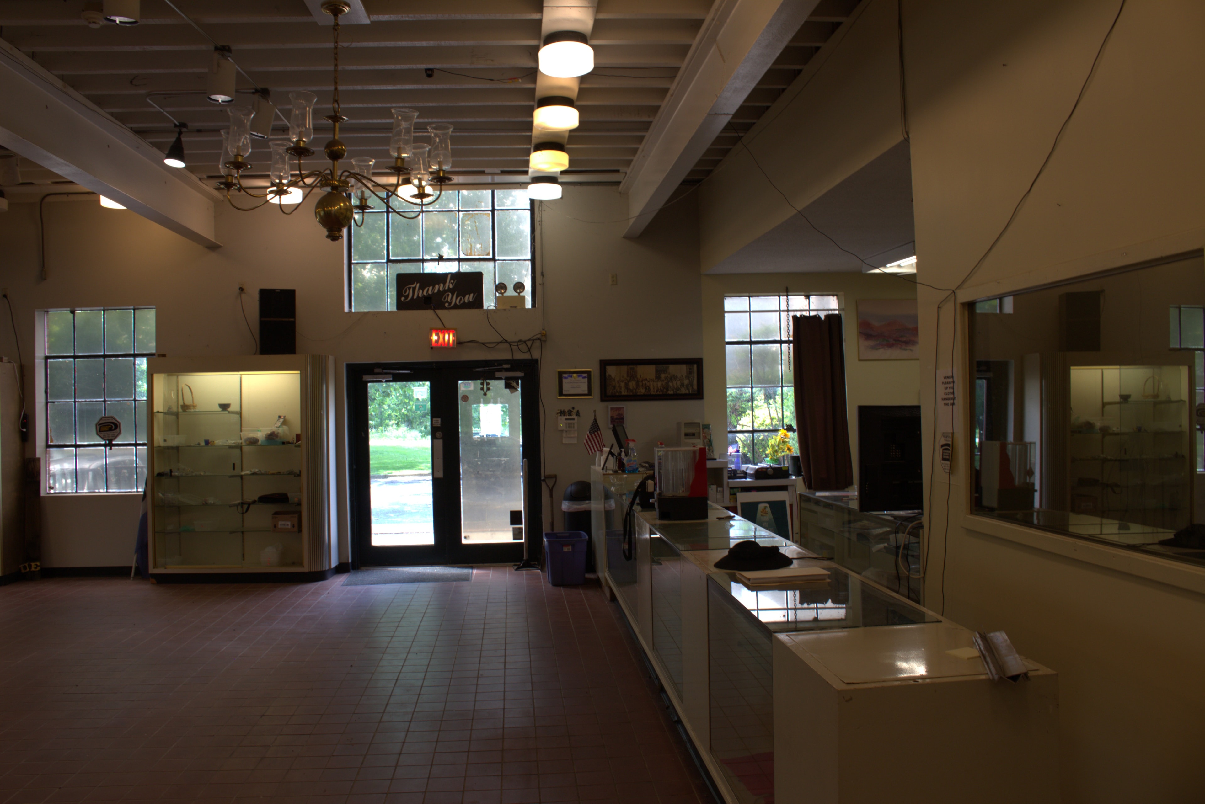 Retail showroom entrance with display cases and large windows